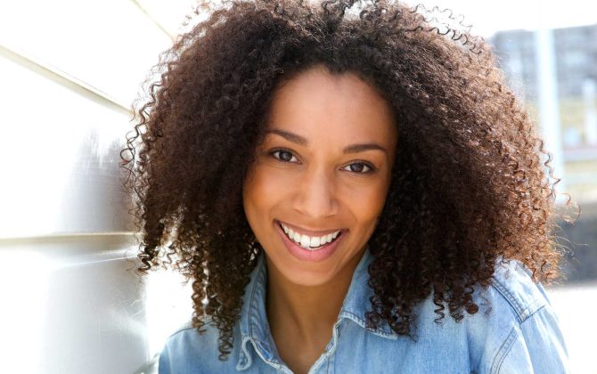 cheerful-young-african-american-woman-PZQTU5RRE.jpg